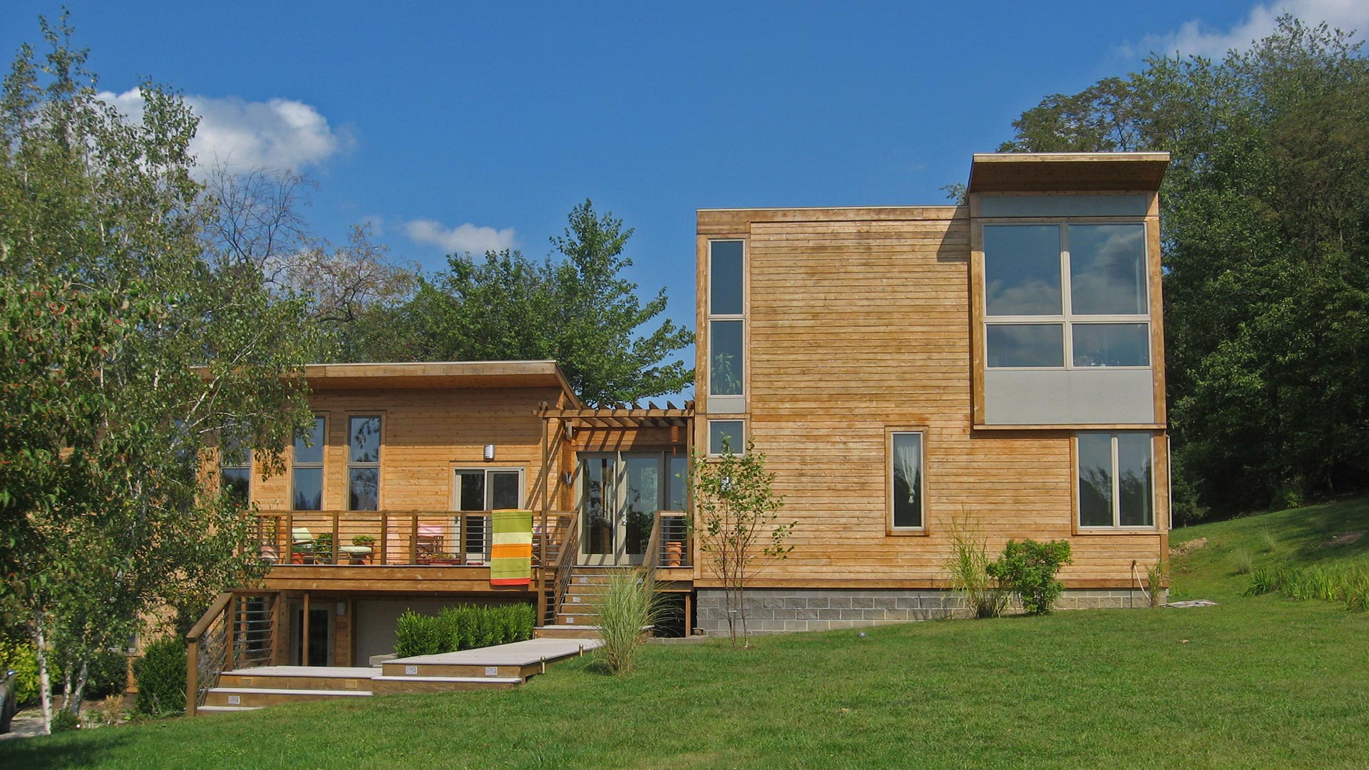 Entrance elevation of wood clad home