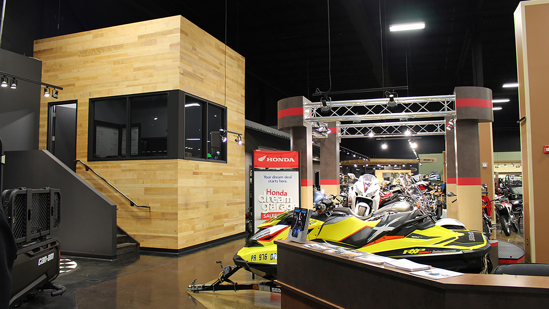 Wood-clad sales office overlooking showroom